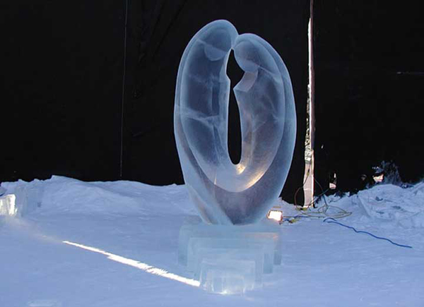 Ice Sculpture “Love” by Qifeng An and Zhe An, completed, with black backdrop.